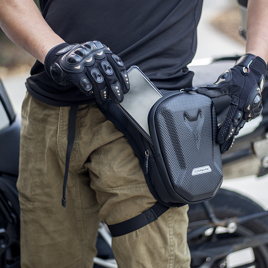 Rider accessing items from EasyRide motorcycle leg bag, showing convenient front opening and organized compartments.